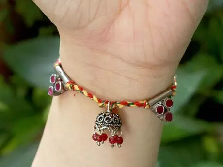 Lumba Rakhi in Braided Thread with 925 Silver motifs and Jhumki Hanging