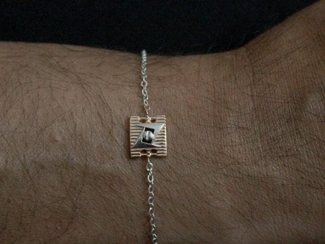925 sterling silver rakhi chain bracelet with Rose Gold-plated motif